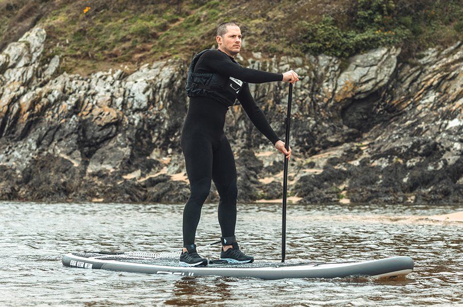 man in gul wetsuit on sup, click for men